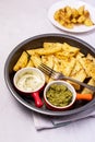 Roasted or Baked Potatoes With Spice in Black Bowl on Light Gray Background Tasty Homemade Dish Dinner Grilled Potatoes Vertical