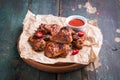 Roasted barbecue chicken wings with bbq sauce, italian herbs, olive oil and pepper