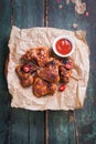 Roasted barbecue chicken wings with bbq sauce, italian herbs, olive oil and pepper Royalty Free Stock Photo
