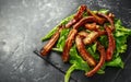 Roasted barbecue hot pork ribs served on stone board with vegetable Royalty Free Stock Photo