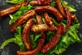 Roasted barbecue hot pork ribs served on stone board with vegetable Royalty Free Stock Photo