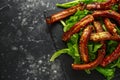 Roasted barbecue hot pork ribs served on stone board with vegetable Royalty Free Stock Photo