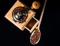 Roasted beans near a vintage manual coffee grinder Royalty Free Stock Photo