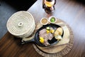 Roasted beef accompanied by peppers and baked potatoes with tortillas, beans and lemons Mexican style