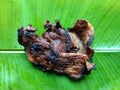 Roasted beef on a banana leaf. Tropical food concept for summer. typical food of Guatemala