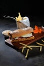 Roasted Beef Sub Sandwich with french fries bucket served on wooden board isolated on dark background side view of breakfast food Royalty Free Stock Photo