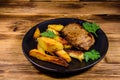 Roasted beefsteak with the fried potato and parsley