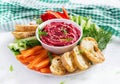 Roasted beet hummus with toast and vegetables. Beetroot hummus. Royalty Free Stock Photo