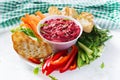 Roasted beet hummus with toast and vegetables. Beetroot hummus. Royalty Free Stock Photo