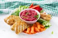 Roasted beet hummus with toast and vegetables. Beetroot hummus. Royalty Free Stock Photo