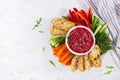Roasted beet hummus with toast and vegetables. Beetroot hummus. Royalty Free Stock Photo