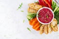 Roasted beet hummus with toast and vegetables. Beetroot hummus. Royalty Free Stock Photo