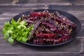 Roasted beetroot in black plate, close up