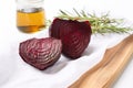 roasted beetroot, cut in half, on white linen cloth