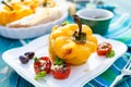 Roasted bell pepper stuffed with quinoa, mushrooms and cheddar cheese with addition aromatic tomatoes Royalty Free Stock Photo