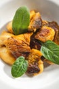 Roasted Boletus or Porcini Mushrooms with Baked Potatoes Isolated