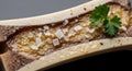 Roasted bone marrow with glossy texture and salt crystals. Isolated on White background Royalty Free Stock Photo