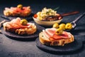 Roasted bread with garlic butter spread and serano ham and olive Royalty Free Stock Photo