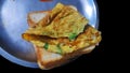 Roasted bread and omelette isolated in black background