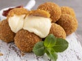 Roasted breaded mozzarella cheese balls with tomato sauce close up Royalty Free Stock Photo