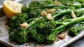 Roasted broccolini with garlic and lemon on a baking tray Royalty Free Stock Photo