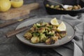 Roasted brussels sprouts portion. Healthy, homemade vegan food or loose weight. Dark background