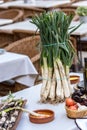 Roasted Calcots onions served on plate with Romesco sauce Ã¢â¬â traditional Catalan winter dish