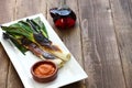 Roasted calcots with romesco sauce for dipping Royalty Free Stock Photo
