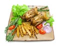 roasted carcass woodcock with potatoes and vegetables on the plate on a white background