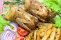 Roasted carcass woodcock with potatoes and vegetables on a plate