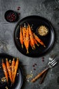 Roasted carrots with dukkah. Vegetarian food. Top view, flat lay.