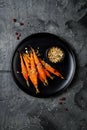 Roasted carrots with dukkah. Vegetarian food. Top view, flat lay.