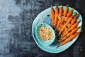 Roasted carrots with dukkah. Vegetarian food. Top view, flat lay.