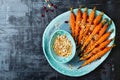 Roasted carrots with dukkah. Vegetarian food. Top view, flat lay.