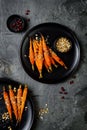 Roasted carrots with dukkah. Vegetarian food. Top view, flat lay.
