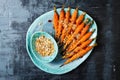 Roasted carrots with dukkah. Vegetarian food. Top view, flat lay.