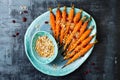 Roasted carrots with dukkah. Vegetarian food. Top view, flat lay.