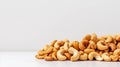 Roasted Cashew Nuts Isolated on a White Uniform Background with Copy Space For Text. Party Food Snacks Royalty Free Stock Photo