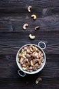 Roasted cashews on natural wooden table background Royalty Free Stock Photo
