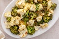 Roasted cauliflower and broccoli on a serving plate, healthy vegetable side dish Royalty Free Stock Photo