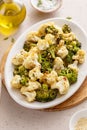 Roasted cauliflower and broccoli on a serving plate, healthy vegetable side dish Royalty Free Stock Photo