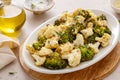 Roasted cauliflower and broccoli on a serving plate, healthy vegetable side dish Royalty Free Stock Photo