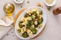 Roasted cauliflower and broccoli on a serving plate, healthy vegetable side dish Royalty Free Stock Photo