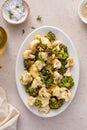 Roasted cauliflower and broccoli on a serving plate, healthy vegetable side dish Royalty Free Stock Photo