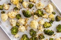 Roasted cauliflower and broccoli on a sheet pan, healthy vegetable side dish Royalty Free Stock Photo