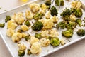 Roasted cauliflower and broccoli on a sheet pan, healthy vegetable side dish Royalty Free Stock Photo