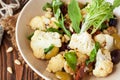 Roasted cauliflower salad with olives, tomatoes, nuts and basil Royalty Free Stock Photo