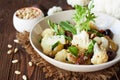 Roasted cauliflower salad with olives, tomatoes, nuts and basil Royalty Free Stock Photo