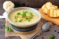 Roasted cauliflower and potato and soup, close up table scene with a wood background Royalty Free Stock Photo