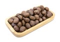 Roasted chesnuts in wooden tray isolated Royalty Free Stock Photo